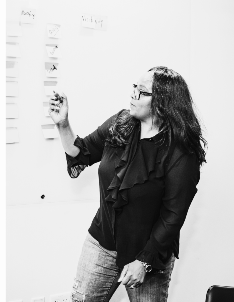 April Gregory explaining VIP Marketing Strategy Day on a whiteboard.